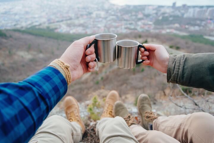 Enjoying a cup of coffee while camping