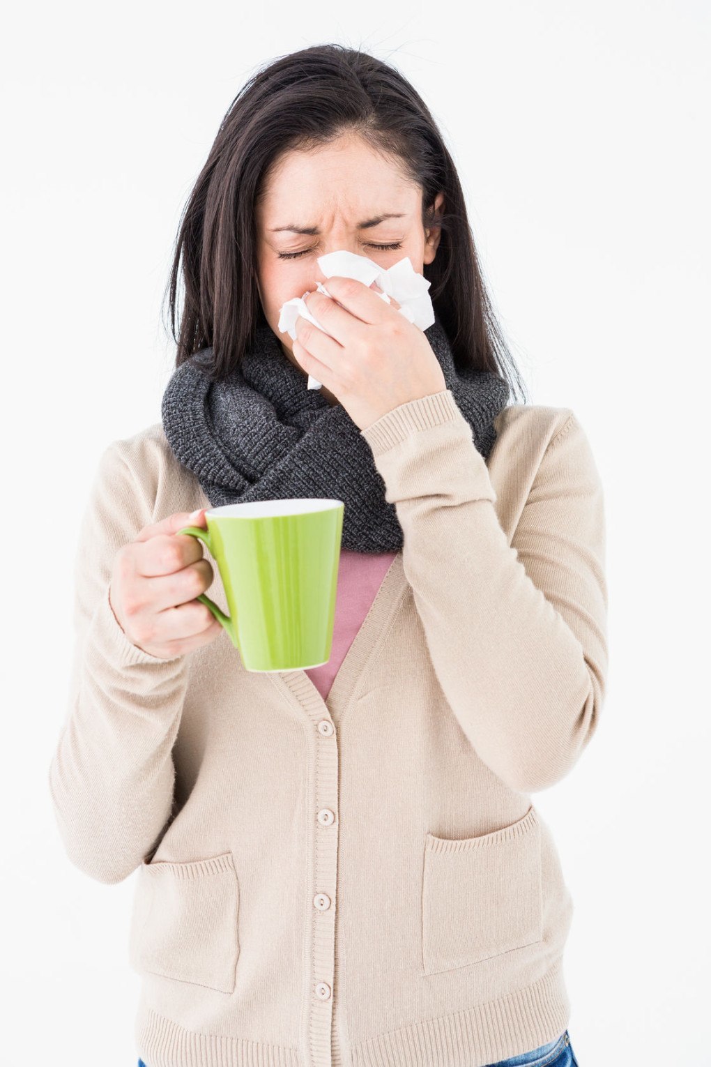 A woman sneezed as she holds her coffee